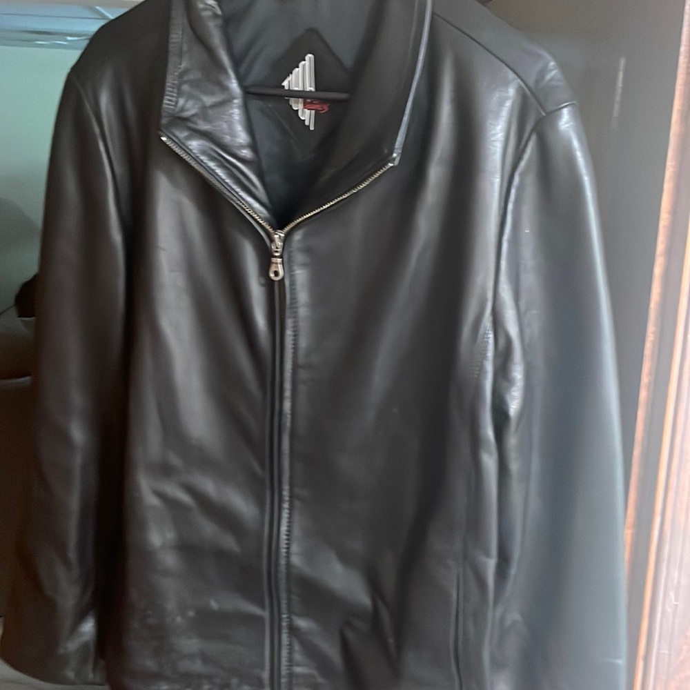 Black authentic leather jacket . Great for any party or night out on the town .